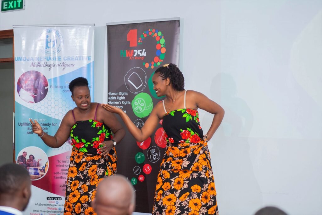 Two Traditional women dance at the Beyond My Status event